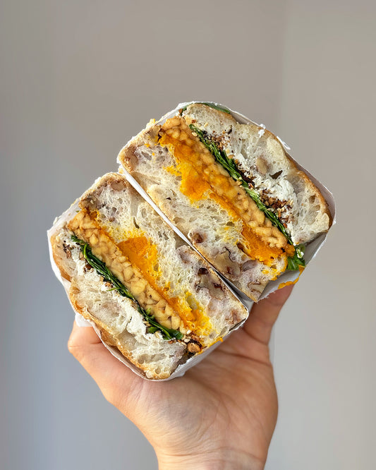 Focaccia 'sammich': Delica pumpkin, dukkah, cashew feta, tempeh and rocket in walnut focaccia